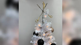 Abortion activist sparks outrage by topping Christmas tree with forceps