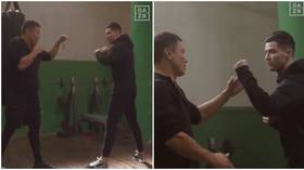 'He looks like a real fighter!': Boxing ace Gennady Golovkin puts Cristiano Ronaldo through his paces in the training room (VIDEO)