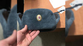 Hat’s just not fair! Ukrainian teenager faces JAIL over Soviet ushanka he picked up at flea market