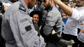 Israeli police commander indicted for assault on youngster during ultra-Orthodox protest against Covid restrictions