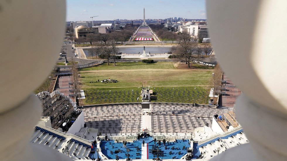 Flag-packed National Mall, razor wire & military patrols give off ...