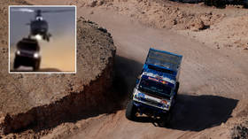 Helicopter rips roof of Russian team's truck in mid-air collision as Dakar rally in Saudi Arabia claims yet another crash (VIDEO)