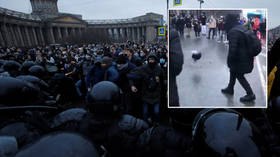 Kicking off: Protestors over imprisoned Kremlin anti-corruption activist Alexey Navalny use riot police helmet as football (VIDEO)