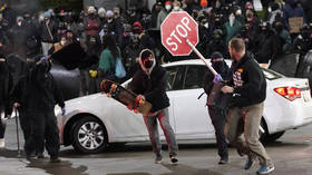 Angry mob trashes businesses, creates burning barricade in protest at Tacoma police plowing through crowd