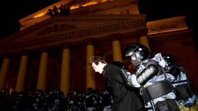 Riot police use batons to break up unplanned demonstrations in central Moscow as Navalny supporters protest his prison sentence