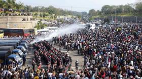 Myanmar police deploy water cannon as thousands continue protests against military coup (VIDEO)