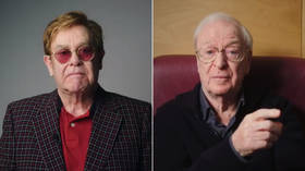 ‘I’m still standin’: Elton John & Michael Caine encourage remaining at-risk Britons to get Covid-19 vaccine (VIDEO)