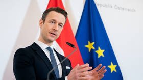 Austrian finance minister's home raided in anti-corruption probe amid calls for him to resign