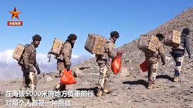 Ho-ho-hiss: Chinese troops in EXOSKELETONS deliver New Year presents to Himalayan outpost (VIDEO)