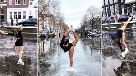 FROZEN! Dutch figure skater Linden van Bemmel wows with impromptu performance on icy Amsterdam canals