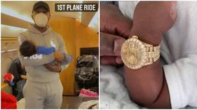 This ain't no normal baby shower: Doting grandfather Floyd Mayweather gifts diamond-encrusted ROLEX to newborn grandson
