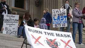 ‘I will not self-suffocate!’ WATCH Idaho demonstrators BURN MASKS at state Capitol