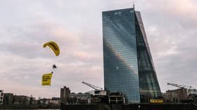 WATCH Greenpeace activists paraglide onto European Central Bank building in fossil fuel protest