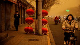 Beijing skies turn ORANGE as massive sandstorm wreaks havoc on air quality in Chinese capital (PHOTOS)