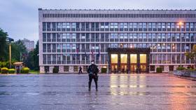 CHAINSAW-armed man who ‘had enough of lockdown' wrestled to ground outside Slovenian parliament (VIDEO)