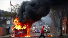 WATCH: Bus TORCHED by petrol bomb as it drives along Belfast road amid ongoing Northern Ireland protests