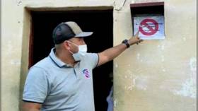 Covid segregation? Venezuelan mayor in hot water after placing warning signs on homes of people who tested positive for virus
