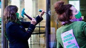 Extinction Rebellion activists arrested outside Barclays London HQ after breaking windows to protest bank’s fossil fuel financing
