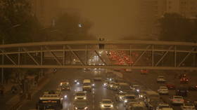 Beijing engulfed in yellow dust as authorities issue blue alert for sandstorms in central China