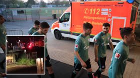 ‘It was pure fear’: Footballers speak of terror after being attacked by fans wielding eggs & firecrackers outside stadium (VIDEO)
