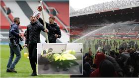 Man United vow to punish ‘criminal activity’ in wake of Old Trafford unrest as footage shows police officer ‘punching protester’