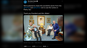 ‘Shrunk to fit?’ Internet puzzles over peculiar photo of Bidens kneeling next to ‘miniature’ Jimmy Carter & his wife