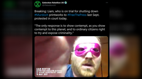 Extinction Rebellion trial delayed after defendant dons pink eye mask & GLUES HIMSELF to courtroom table (VIDEO)