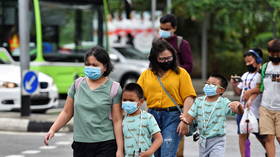 Singapore approves Pfizer Covid-19 jab for use in children as it opts to close schools amid coronavirus spike