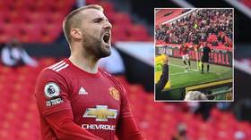 Man United star Shaw vows to help fan ‘threatened with THREE-YEAR BAN’ for throwing protest scarf at England defender (VIDEO)