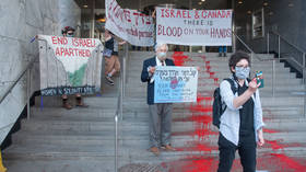 Jewish anti-war activists paint ‘river of blood’ on steps of Israeli Consulate in Toronto to protest Gaza strikes