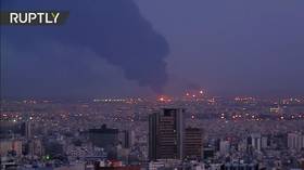 Huge plume of black smoke towers over Tehran as major blaze breaks out at Iranian refinery (VIDEOS)