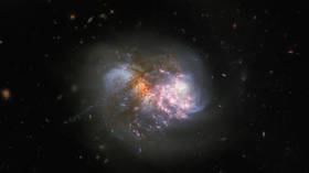 Clash of the Titans: Hubble telescope captures cataclysmic cosmic collision of galaxy pair on verge of merging