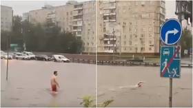 VIDEOS show defiant Russians SWIMMING in Moscow’s flooded streets as ‘super rain’ turns roads into canals