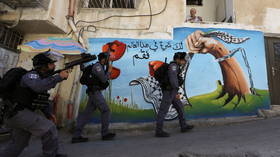 Israeli police clash with Palestinians trying to prevent demolition of Arab-owned shop in East Jerusalem