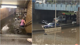 New Yorkers trudge through waist-high water as flash floods fill subway stations & shut down roadways (VIDEOS)