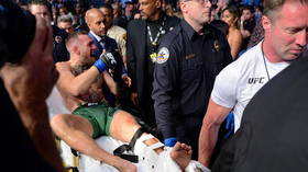 Defiant Conor McGregor issues first message since being stretchered out of octagon with horror leg injury at UFC 264
