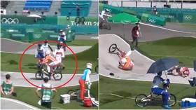 Dutch BMX ace collides with hapless Olympic official who strayed onto track – and star now faces fitness battle to compete (VIDEO)