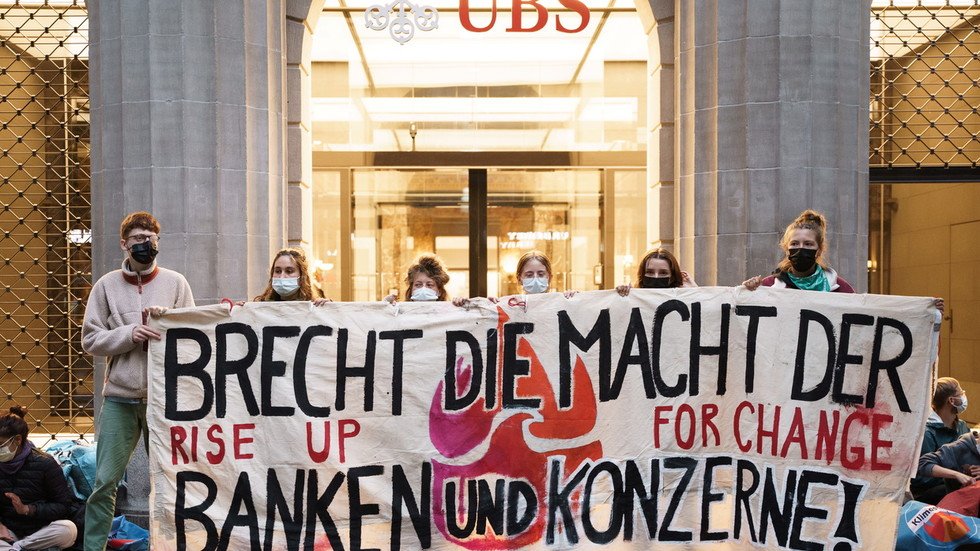 Zurich police remove 200 climate activists blocking banks over fossil