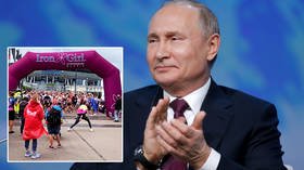 Putin hails ‘truly great’ inaugural Russian Ironman as grueling triathlon takes place in St Petersburg for the first time (VIDEO)