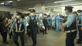 At least 10 injured during knife attack on Tokyo train, suspect detained after escape