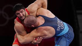 ‘This was a PROVOCATION’: Russian wrestling stars removed from flight in face mask row on way to World Championships