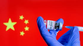 China administers 1.8 billion Covid vaccines as Sinovac says third shot delivers big increase in immunity