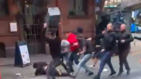 'Welcome back, football': Manchester United and Leeds fans clash on the streets ahead of Saturday's Premier League opener (VIDEO)