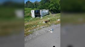 New York tour bus veers off interstate and rolls over, leaving more than 50 people injured (PHOTO)