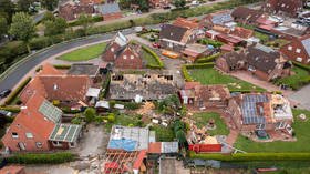 Roofs ripped off houses as suspected TORNADO leaves path of destruction in northern Germany (VIDEOS)