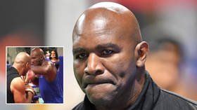‘This circus needs to end’: Fans express concern as ring legend Holyfield struggles on the pads ahead of Belfort bout (VIDEO)