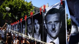 French billboard owner hit with €10,000 fine for depicting president Macron as Hitler on Covid protest poster