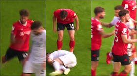 ‘Got what he deserved’: Fans split after footballer is viciously kicked by opponent... only to be booked by ref in England (VIDEO)