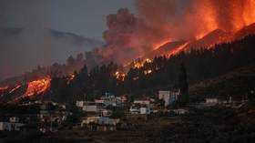 Volcanic eruption forces 5,000 people to flee La Palma villages as lava flow destroys homes