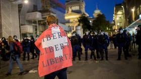 WATCH: Swiss police use rubber bullets, tear gas and water cannon to disperse Bern protest against Covid passports